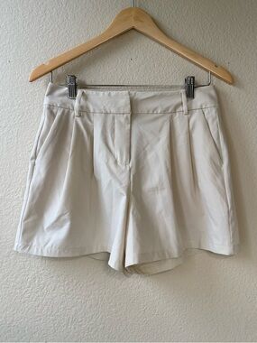 High-Rise Cream Bermuda Shorts with Front Pleats